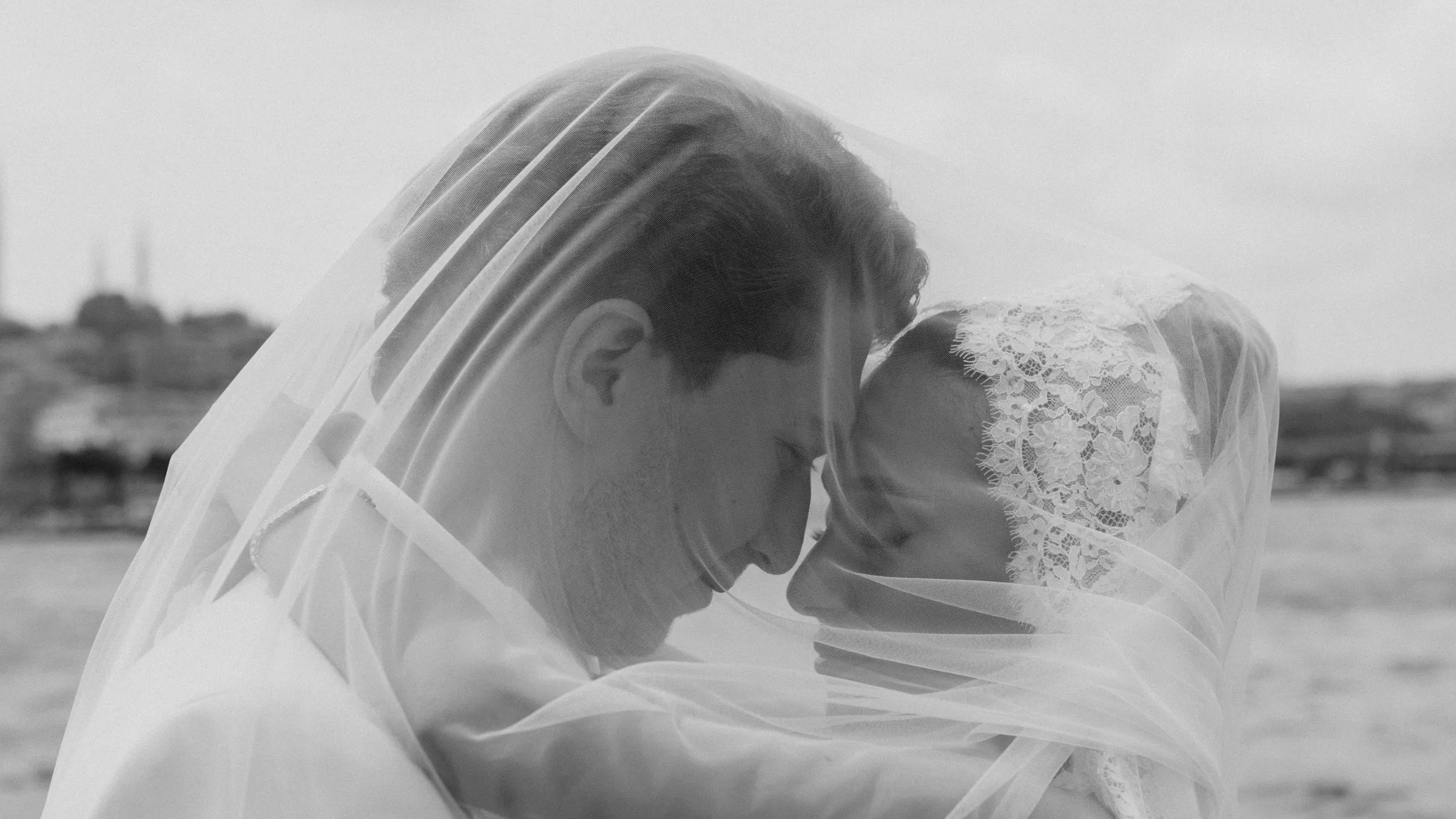 Bride and groom beneath a lace veil, Istanbul