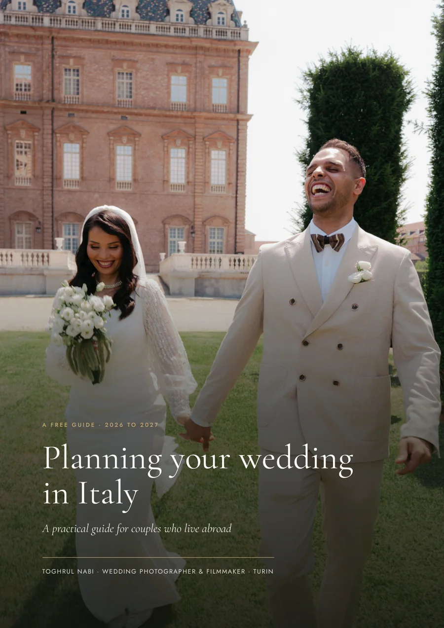 The cover of a guide titled Planning your wedding in Italy, a practical guide for couples who live abroad, over a photo of a bride and groom walking hand in hand