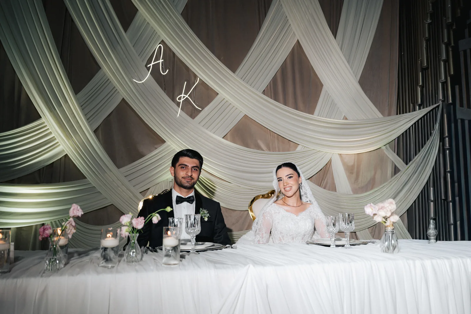 Allahverdi and Kimya at their candlelit sweetheart table during the reception in Baku