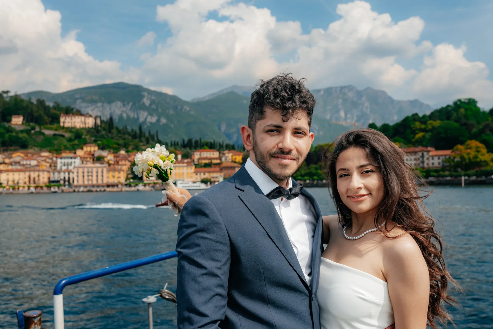 A couple smiling on a Lake Como car ferry (not at Villa Balbiano)